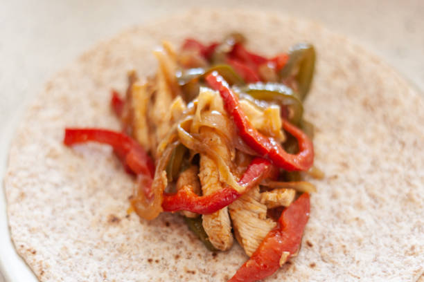 Sheet pan chicken fajitas with peppers and onions